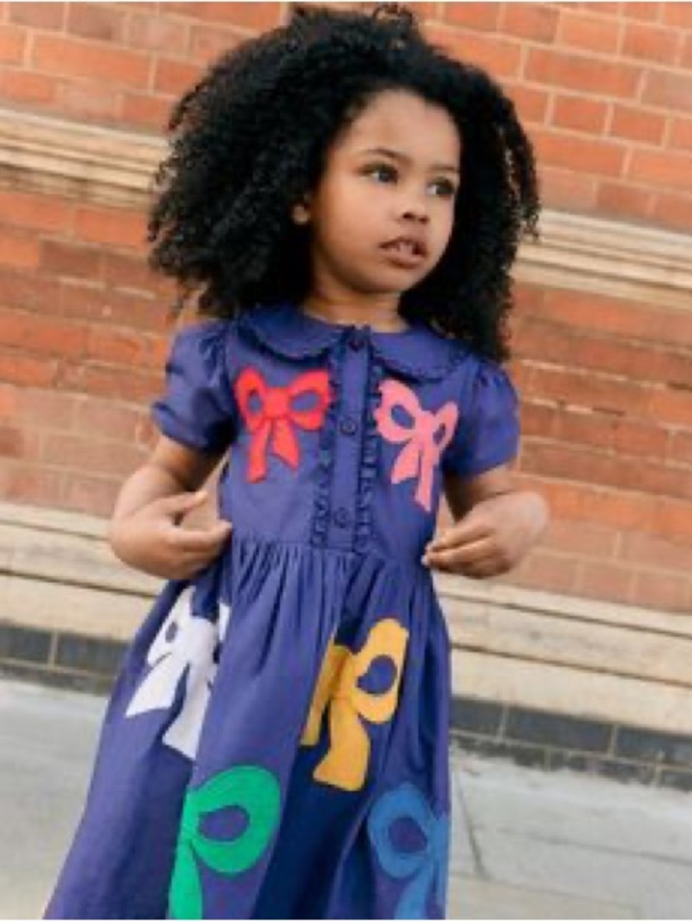 Mini Boden size 4-5Y Navy Dress with Multicolored Bow Prints